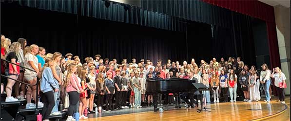 chorus on stage on risers