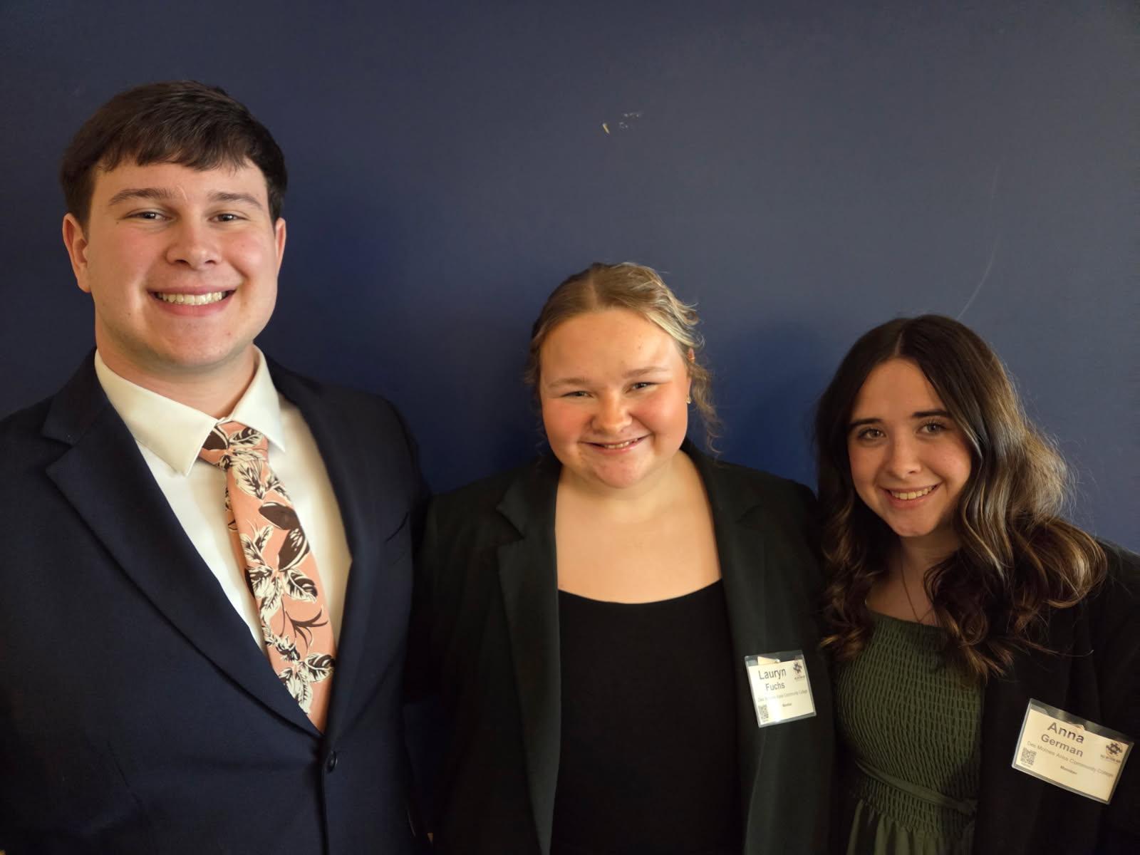 Three students pose for photo
